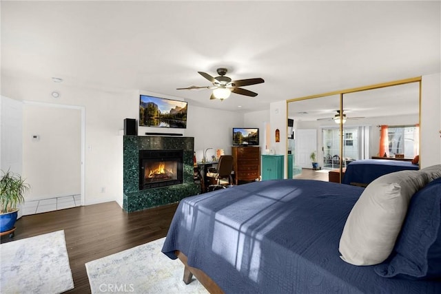 1320 Carob Way, Montebello, CA 90640 - bedroom with a fireplace, wood finished floors, ceiling fan, and a closet