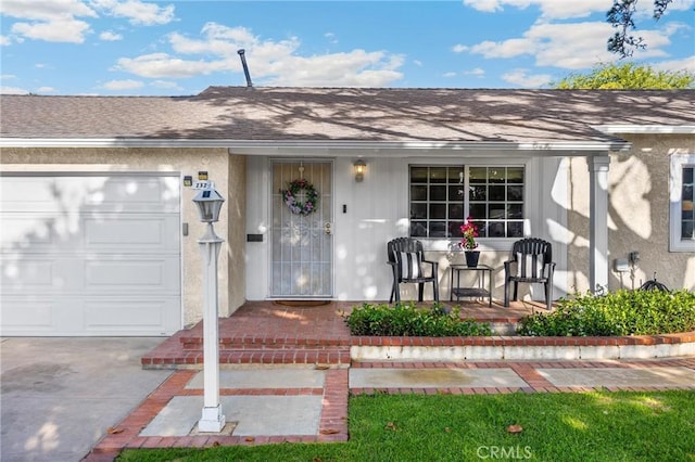 1320 Carob Way, Montebello, CA 90640 - entrance to property with an attached garage, roof with shingles, and covered porch