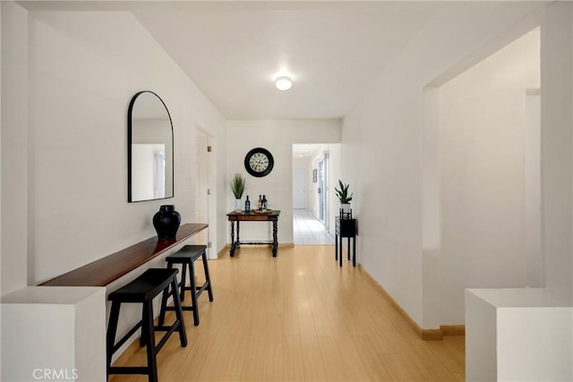 1320 Carob Way, Montebello, CA 90640 - hallway with light wood-style floors and baseboards