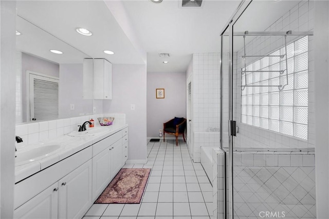 1320 Carob Way, Montebello, CA 90640 - full bathroom with double vanity, tile patterned flooring, a bathtub, a stall shower, and recessed lighting