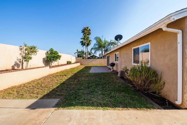 2133 Manchester Ave, Escondido, CA 92027 - fenced backyard with a patio area