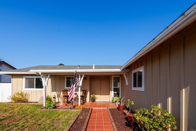 2133 Manchester Ave, Escondido, CA 92027 - doorway to property featuring board and batten siding, a yard, and a patio area