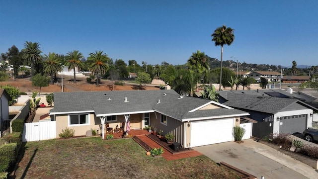 2133 Manchester Ave, Escondido, CA 92027 - ranch-style home with a garage, concrete driveway, covered porch, and roof with shingles
