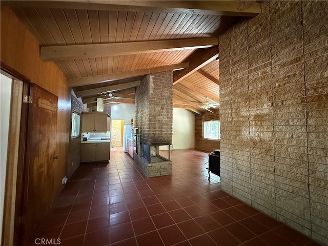 11955 Santa Lucia Rd, Atascadero, CA 93422 - hallway featuring wood ceiling, dark tile patterned flooring, wooden walls, and brick wall