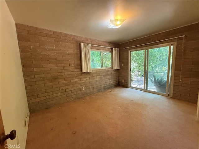 11955 Santa Lucia Rd, Atascadero, CA 93422 - unfurnished room with brick wall and carpet