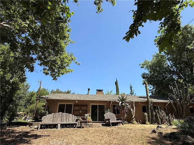 11955 Santa Lucia Rd, Atascadero, CA 93422 - back of property with a chimney and brick siding