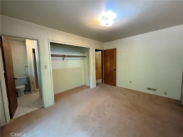 11955 Santa Lucia Rd, Atascadero, CA 93422 - unfurnished bedroom featuring a closet, light carpet, and ensuite bathroom