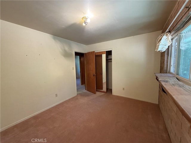 11955 Santa Lucia Rd, Atascadero, CA 93422 - unfurnished bedroom featuring light colored carpet and a closet
