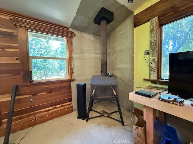 11955 Santa Lucia Rd, Atascadero, CA 93422 - miscellaneous room with concrete flooring and a wood stove