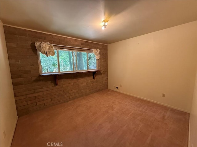 11955 Santa Lucia Rd, Atascadero, CA 93422 - unfurnished room with light carpet and brick wall