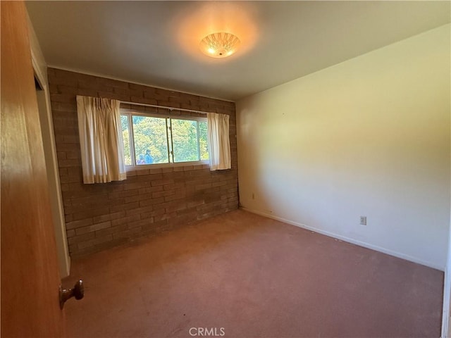 11955 Santa Lucia Rd, Atascadero, CA 93422 - unfurnished room featuring carpet flooring and brick wall