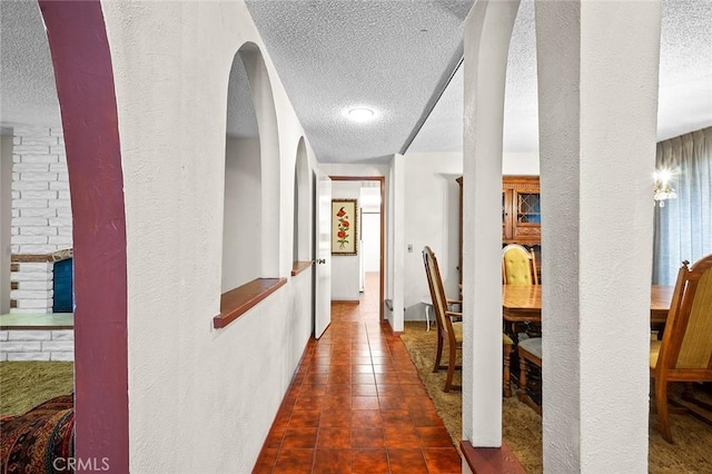 1500 Country Club Dr, Riverside, CA 92506 - hallway featuring a textured ceiling and a textured wall