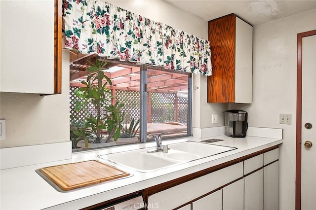 1500 Country Club Dr, Riverside, CA 92506 - kitchen featuring light countertops and white cabinets