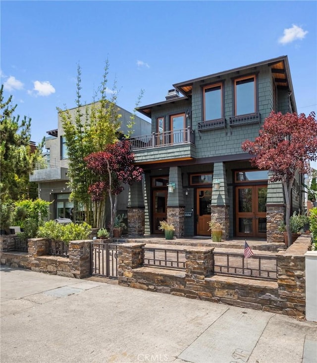 401 8th St, Manhattan Beach, CA 90266 - view of front of property with a balcony, french doors, and stone siding