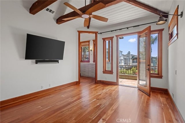 401 8th St, Manhattan Beach, CA 90266 - unfurnished living room featuring beam ceiling, plenty of natural light, light wood-style flooring, and ceiling fan