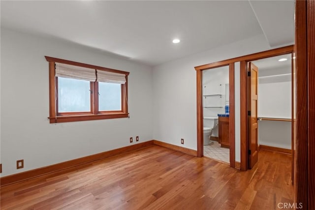 401 8th St, Manhattan Beach, CA 90266 - unfurnished bedroom featuring light wood-style flooring, recessed lighting, and connected bathroom