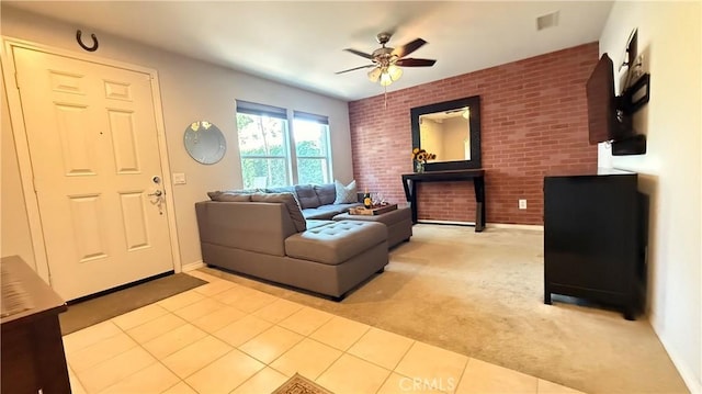 163 Clementine Ct, Covina, CA 91723 - living area featuring brick wall, ceiling fan, light carpet, and light tile patterned floors