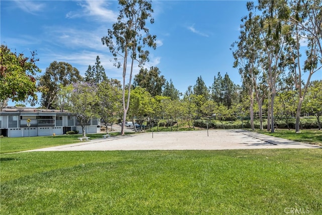 23372 Caminito Marcial Unit 187, Laguna Hills, CA 92653 - surrounding community with a lawn and volleyball court