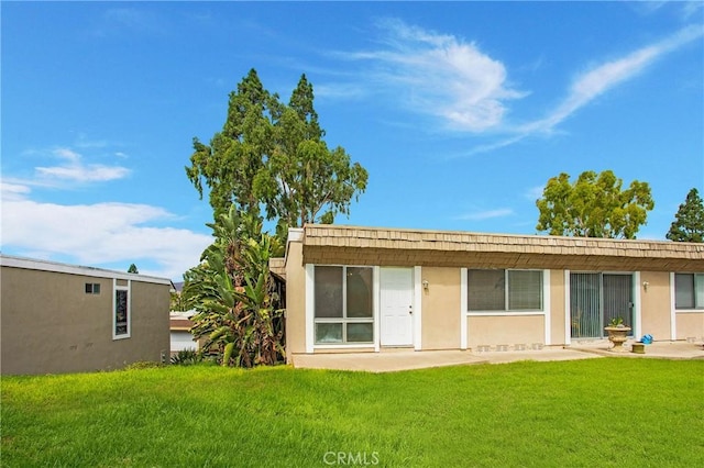 23372 Caminito Marcial Unit 187, Laguna Hills, CA 92653 - rear view of house featuring a yard and a patio area