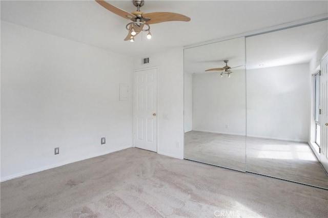 23372 Caminito Marcial Unit 187, Laguna Hills, CA 92653 - unfurnished bedroom with carpet flooring, a closet, and a ceiling fan