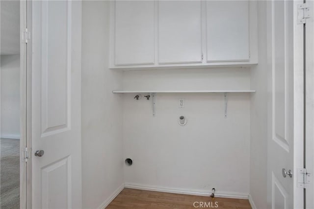 23372 Caminito Marcial Unit 187, Laguna Hills, CA 92653 - laundry room with gas dryer hookup, cabinet space, wood finished floors, and washer hookup