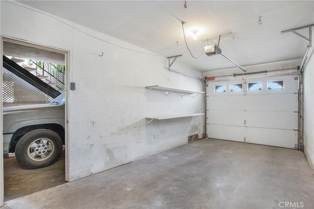 23372 Caminito Marcial Unit 187, Laguna Hills, CA 92653 - garage with a garage door opener