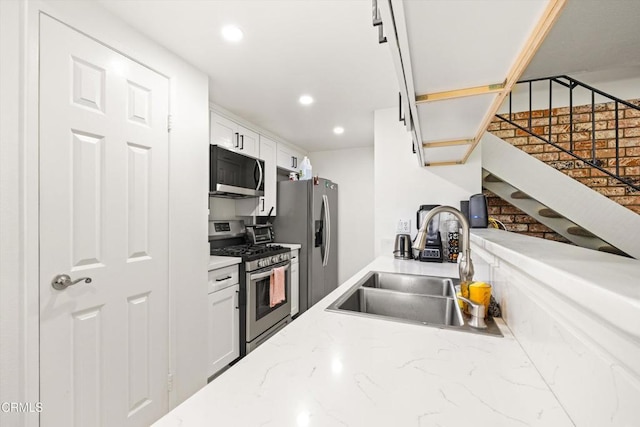 1222 Acadia Pl, Ventura, CA 93003 - kitchen featuring appliances with stainless steel finishes, white cabinetry, recessed lighting, and light stone countertops