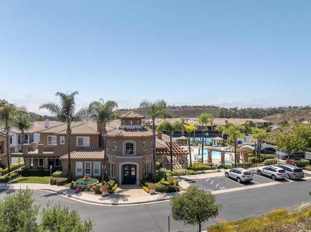 12625 Fiorenza Ln Unit 236, San Diego, CA 92128 - view of asphalt road with curbs, sidewalks, and a residential view