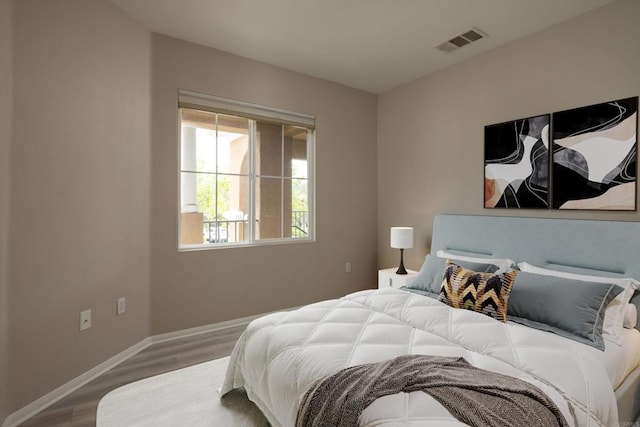 12625 Fiorenza Ln Unit 236, San Diego, CA 92128 - bedroom with wood finished floors and baseboards