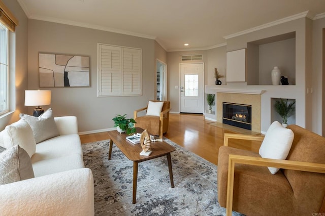 12625 Fiorenza Ln Unit 236, San Diego, CA 92128 - living room with wood finished floors, a high end fireplace, recessed lighting, and crown molding