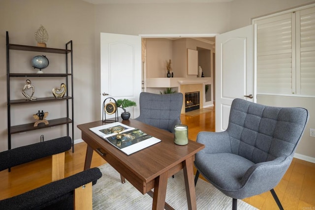 12625 Fiorenza Ln Unit 236, San Diego, CA 92128 - office area featuring wood finished floors and a fireplace with flush hearth