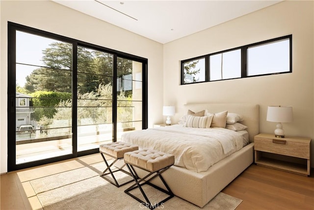 4724 Lemona Ave, Sherman Oaks, CA 91403 - bedroom featuring multiple windows, light wood-type flooring, and access to outside