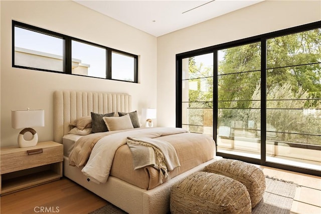 4724 Lemona Ave, Sherman Oaks, CA 91403 - bedroom featuring wood finished floors and access to exterior