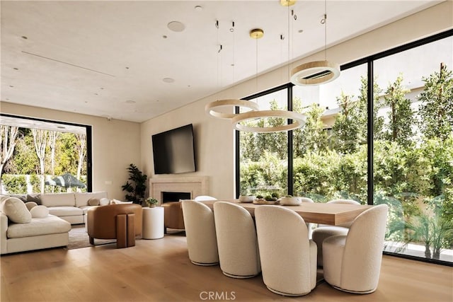 4724 Lemona Ave, Sherman Oaks, CA 91403 - dining area with wood finished floors and a fireplace