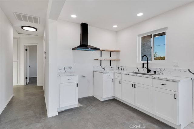 61638 La Jolla Dr, Joshua Tree, CA 92252 - kitchen with wall chimney range hood, concrete flooring, open shelves, white cabinets, and light stone counters