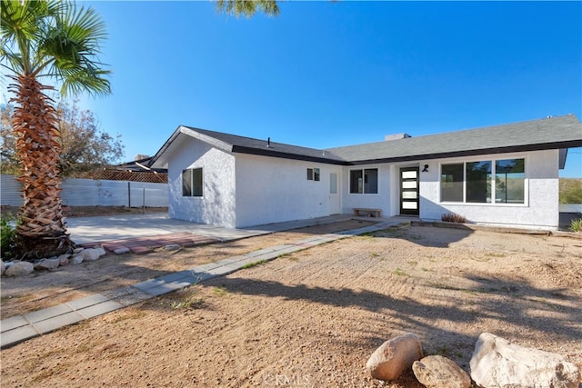 61638 La Jolla Dr, Joshua Tree, CA 92252 - rear view of house with a patio area and stucco siding