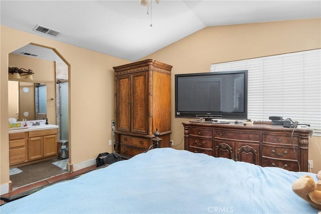 2306 Apion Ct, Paso Robles, CA 93446 - bedroom with vaulted ceiling, ensuite bath, wood finished floors, arched walkways, and ceiling fan