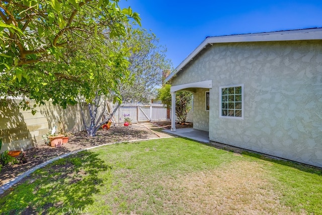 9230 Whitney Way, Cypress, CA 90630 - fenced backyard featuring a patio area