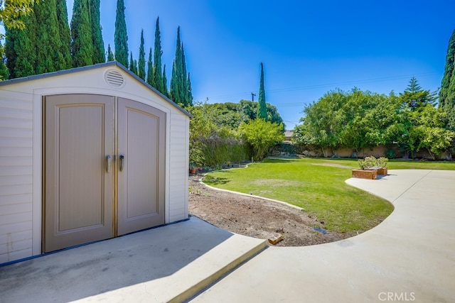 9230 Whitney Way, Cypress, CA 90630 - view of yard with a storage unit and a patio area