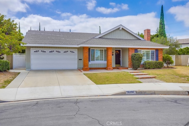 9230 Whitney Way, Cypress, CA 90630 - view of front of house with an attached garage, driveway, a chimney, and a shingled roof