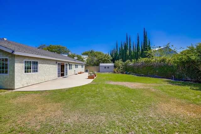 9230 Whitney Way, Cypress, CA 90630 - view of grassy yard featuring a patio area and a shed