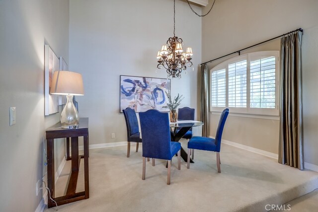 9230 Whitney Way, Cypress, CA 90630 - carpeted dining room with a chandelier and a towering ceiling