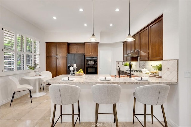 4450 Autumn Glow Ct, Chino Hills, CA 91709 - kitchen featuring black appliances, a peninsula, backsplash, under cabinet range hood, and recessed lighting