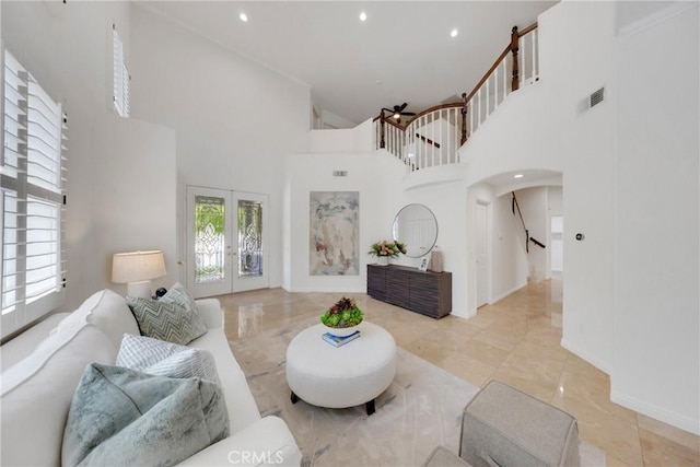 4450 Autumn Glow Ct, Chino Hills, CA 91709 - living room with a towering ceiling, arched walkways, stairway, recessed lighting, and french doors