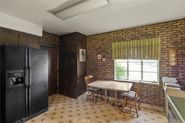 1603 Colusa St, Corning, CA 96021 - dining space featuring brick wall and light flooring