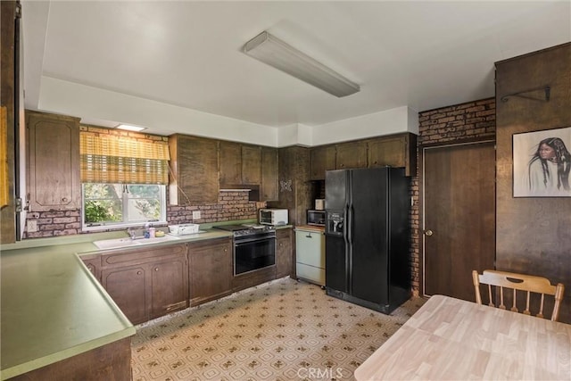 1603 Colusa St, Corning, CA 96021 - kitchen with black fridge with ice dispenser, stove, light countertops, wall oven, and dark brown cabinetry