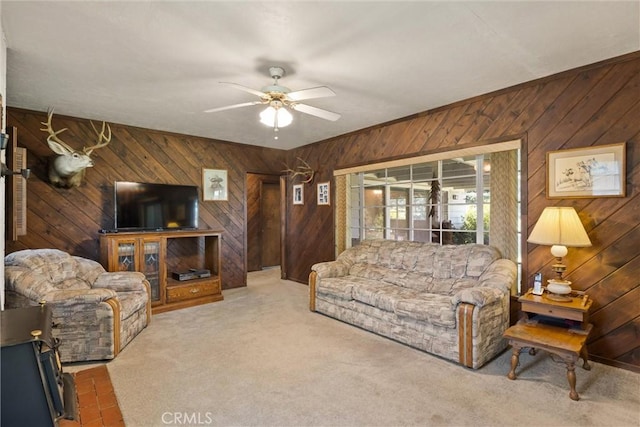 1603 Colusa St, Corning, CA 96021 - living room featuring wood walls, ceiling fan, and carpet floors
