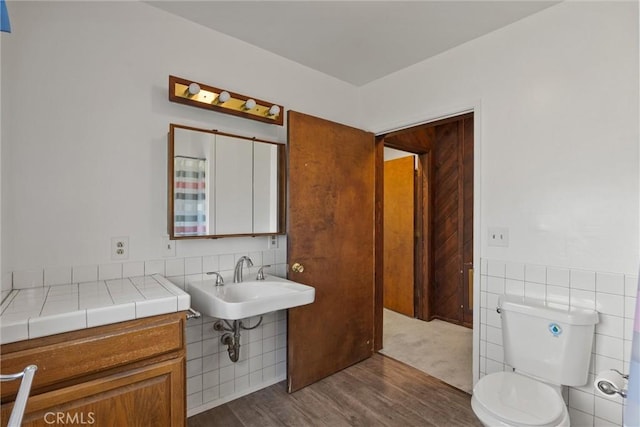 1603 Colusa St, Corning, CA 96021 - bathroom with tile walls and wood finished floors