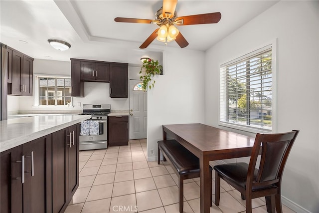 2051 Royal Oaks Dr, Duarte, CA 91010 - kitchen with stainless steel range with gas stovetop, plenty of natural light, dark brown cabinetry, and ceiling fan