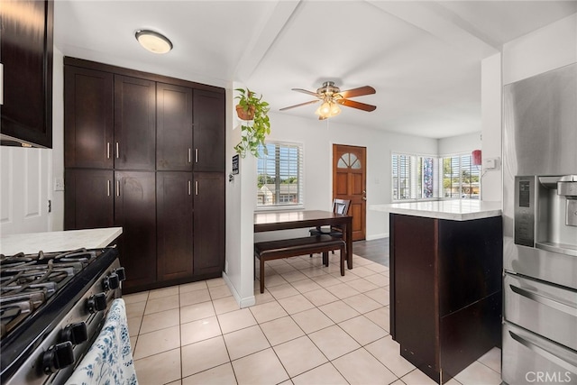 2051 Royal Oaks Dr, Duarte, CA 91010 - kitchen featuring appliances with stainless steel finishes, dark brown cabinetry, a ceiling fan, and light tile patterned floors